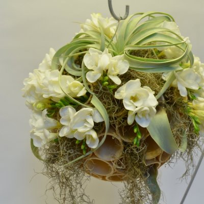 Ice cream cone filled with white Freesia