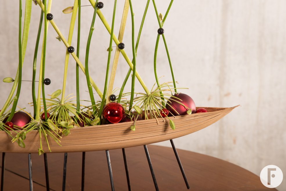 an unusual base makes this arrangement stand out