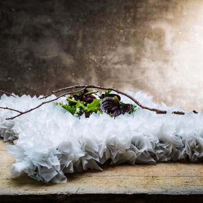 Funeral flower design with white paper and Anthurium