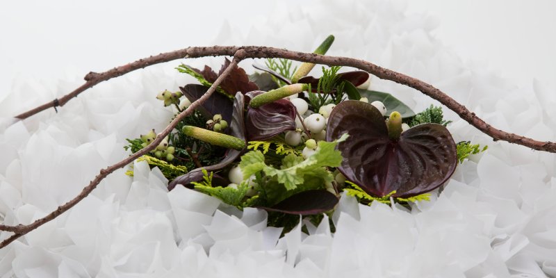 Funeral design with white paper and Anthurium - close up