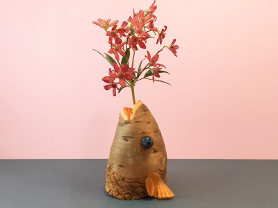 Edible arrangements with fruit and vegetable vases